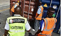 Customs officers inspecting a container for clearance.